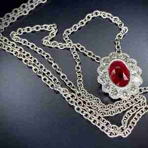 Antique style, white gold Ruby & Diamond halo pendant.